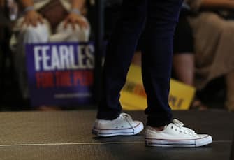 MOUNT PLEASANT, IOWA - AUGUST 11: Democratic presidential candidate U.S. Sen. Kamala Harris (D-CA) wears sneakers as she speaks during a for the people campaign rally on August 11, 2019 in Mount Pleasant, Iowa. Kamala Harris is on a five day river-to-river bus tour across Iowa promoting her "3AM Agenda" to Iowans.  (Photo by Justin Sullivan/Getty Images)