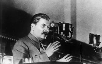 1936:  Soviet leader Joseph Stalin (Iosif Vissarionovich Dzhugashvili, 1879 - 1953), addressing the Extraordinary 8th All Union Congress of Soviets on the draft of the USSR's constitution.  (Photo by Hulton Archive/Getty Images)