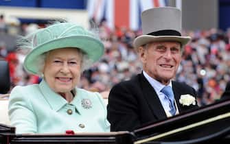 epa09123944 (FILE) - A picture dated 21 June 2012 shows Britain's Queen Elizabeth II (L) and her husband Prince Philip, Duke of Edinburgh arriving to attend Ladies Day at Royal Ascot race meeting, in Ascot, Britain  (reissued 09 April 2021. According to the Buckingham Palace, Prince Philip has died aged 99.  EPA/ANDY RAIN
