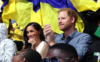 DUESSELDORF, GERMANY - SEPTEMBER 14: Meghan, Duchess of Sussex Prince, and Prince Harry, Duke of Sussex, attend with fans the Ukraine Nigeria Mixed Team Preliminary Round - Pool A Sitting Volleyball match during day five of the Invictus Games Düsseldorf 2023 on September 14, 2023 in Duesseldorf, Germany. (Photo by Chris Jackson/Getty Images for the Invictus Games Foundation)