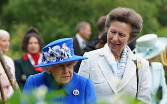 Queen Elizabeth II and the Princess Royal during a visit to a community project in Glasgow, as part of her traditional trip to Scotland for Holyrood Week. Picture date: Wednesday June 30, 2021.