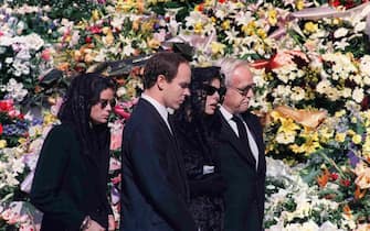 The Royal Family of Monaco, (L-R) Princess Stephanie, Prince Albert, Princess Caroline and Prince Rainier III, arrives 06 October 1990 at the Monaco cathedral for the funeral ceremony for Princess Caroline's husband Stefano Casiraghi who was killed in an offshore powerboat racing accident off the coast of Monaco 03 October 1990 while defending his World Off-shore title.  AFP PHOTO (Photo credit should read -/AFP via Getty Images)