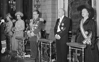 (Original Caption) Monaco's ruler ascends throne. Monaco: Prince Rainier III (center), 26, who last November officially succeeded his late grandfather, Prince Louis II, as ruler of Monaco, is flanked by members of the Royal family during enthronement ceremonies held this week. Others (from left) are: Princess Antoinette of Monaco; Princess Charlotte, the ruler's mother; Prince Pierre and Princess Ghislaine. The tiny principality, located on a peninsula in the Mediterranean, celebrated with five days of colorful festivities.
