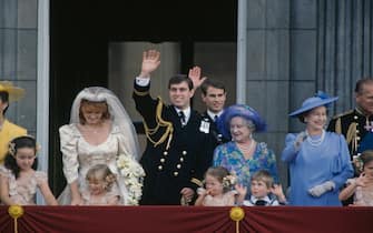 Members of the British royal family on the balcony at Buckingham Palace after the wedding of Prince Andrew and Sarah Ferguson, London, 23rd July 1986. Adults, left to right: Sarah Ferguson, Prince Andrew, Prince Edward, the Queen Mother (1900 - 2002), Queen Elizabeth and Prince Philip. (Photo by Fox Photos/Hulton Archive/Getty Images)