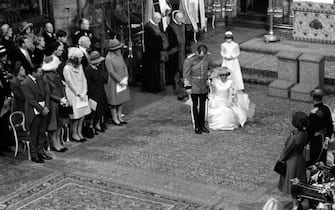 Captain Mark Phillips bows and his wife Princess Anne curtsies to her mother, HRH, Queen Elizabeth II, during the wedding ceremony at Westminster Abbey.   (Photo by PA Images via Getty Images)