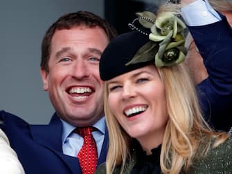 CHELTENHAM, UNITED KINGDOM - MARCH 10: (EMBARGOED FOR PUBLICATION IN UK NEWSPAPERS UNTIL 24 HOURS AFTER CREATE DATE AND TIME) Peter Phillips and Autumn Phillips watch the racing as they attend day 1 'Champion Day' of the Cheltenham Festival 2020 at Cheltenham Racecourse on March 10, 2020 in Cheltenham, England. (Photo by Max Mumby/Indigo/Getty Images)