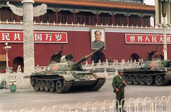 People's Liberation Army tanks are still positioned at Tiananmen Square on June 9, 1989 while life slowly started returning to normal. A series of pro-democracy protests was sparked by the April 15 death of former communist party leader Hu Yaobang. In a show of force, 04 June, China leaders vented their fury and frustration on student dissidents and their pro-democracy supporters. Several hundred people have been killed and thousands wounded when soldiers moved on Tiananmen Square during a violent military crackdown ending six weeks of student demonstrations, known as the Beijing Spring movement. According to Amnesty International, five years after the crushing of the Chinese pro-democracy movement, "thousands" of prisoners remained in jail. AFP PHOTO CATHERINE HENRIETTE (Photo by CATHERINE HENRIETTE / AFP)        (Photo credit should read CATHERINE HENRIETTE/AFP via Getty Images)