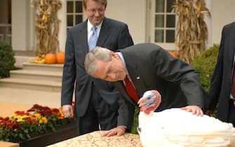 George W Bush graces the turkeys to the White House