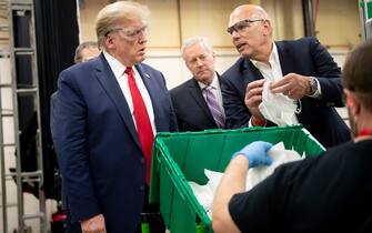 US President Donald Trump tours a Honeywell International Inc. factory producing N95 masks during his first trip since widespread COVID-19 related lockdowns went into effect May 5, 2020, in Phoenix, Arizona. (Photo by Brendan Smialowski / AFP) (Photo by BRENDAN SMIALOWSKI/AFP via Getty Images)