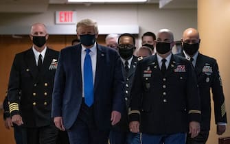 1226607065 US President Donald Trump wears a mask as he visits Walter Reed National Military Medical Center in Bethesda, Maryland on July 11, 2020. (Photo by ALEX EDELMAN / AFP) (Photo by ALEX EDELMAN/AFP via Getty Images)