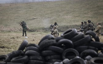 epa04689226 Ukrainian servicemen of the 'Donbass battalion' in action during a training session at a shooting range near the eastern city of Mariupol, Ukraine, 01 April 2015. Eastern Europe is seeing an upswing in military exercises, people training to be reservists and talk of resuming conscription. Some countries have even gone ahead and brought back the draft because Russia's recent behaviour has the Baltic republics and Central Europe rattled. German Chancellor Angela Merkel on 01 April urged the warring parties in Ukraine to follow through on their February truce and implement the rest of the promises aimed at ending the conflict.  EPA/ROMAN PILIPEY