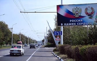 A billboard reading "Russia in our hearts" sits on the side of a road in the town of Tiraspol, the capital of Transnistria - Moldova's pro-Russian breakaway region on the eastern border with Ukraine, on September 11, 2021. (Photo by Sergei GAPON / AFP) (Photo by SERGEI GAPON/AFP via Getty Images)