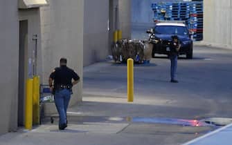 epa07756169 Police outside the cirme scene as officer continue investigating the mass shooting at a Walmart in El Paso, Texas, 04 August 2019. Twenty people killed and forty injured from the mass shooting at the Walmart in El Paso, Texas on 03 August 2019.  EPA/LARRY W. SMITH