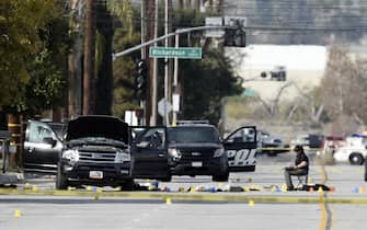 epa05053448 Evidence tags and debris surround the SUV that is thought to be the getaway vehicle of the husband and wife gunmen in the aftermath of the deadly mass shooting in San Bernardino, California, USA 03 December 2015.  The shooting spree in which 14 people were killed and 17 wounded in San Bernardino was carried out by a local couple, police said overnight. The suspects, who died in a shootout with police hours after the massacre 02 December at a conference centre, were Syed Rizwan Farook, 28, and Tashfeen Malik, 27, the San Bernardino County Sheriff's Office said.  EPA/PAUL BUCK