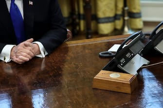 WASHINGTON, DC - FEBRUARY 22: President Donald Trump is reflected on the resolute desk as he speaks during a meeting with Chinese Vice Premier Liu He, right, in the Oval Office of the White House on February 22 in Washington, DC. Liu He, is leading trade talks with U.S. officials in Washington.

(Photo by Oliver Contreras/For The Washington Post via Getty Images)