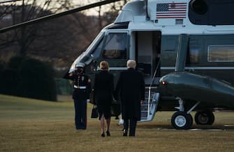 WASHINGTON, DC - JANUARY 20: President Donald Trump and first lady Melania Trump prepare to depart the White House on Marine One on January 20, 2021 in Washington, DC. Trump is making his scheduled departure from the White House for Florida, several hours ahead of the inauguration ceremony for his successor Joe Biden, making him the first president in more than 150 years to refuse to attend the inauguration. (Photo by Eric Thayer/Getty Images)