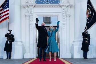 WASHINGTON, DC - JANUARY 20: President Joe Biden and first lady Dr. Jill Biden wave as they arrive at the North Portico of the White House, on January 20, 2021, in Washington, DC. During today's inauguration ceremony Joe Biden became the 46th president of the United States. (Photo by Alex Brandon-Pool/Getty Images)