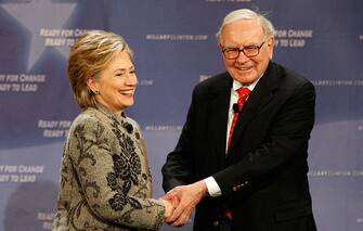 SAN FRANCISCO - DECEMBER 11:  Democratic presidential hopeful Hillary Clinton and billionaire investor Warren Buffett shake hands onstage at a fund-raising event December 11, 2007 in San Francisco, California. The junior U.S. senator from New York was joined by Buffet, who has not endorsed Clinton and has also hosted a fundraiser for Clinton's chief rival for the Democratic nomination, Sen. Barack Obama of Illinois. Buffet has called both candidates "presidential."  (Photo by Justin Sullivan/Getty Images)