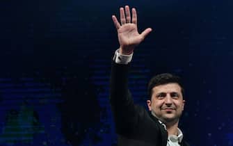 Ukrainian comic actor, showman and presidential candidate Volodymyr Zelensky waves to supporters as he performs with his "95th block" comedy group in small town Brovary, near Kiev, on March 29, 2019. - As other candidates in the unpredictable race made last-ditch appeals to the electorate on Friday, Zelensky - who is comfortably ahead in polls - was performing with his sketch troupe at an arena in the Kiev suburbs. (Photo by Genya SAVILOV / AFP) (Photo by GENYA SAVILOV/AFP via Getty Images)