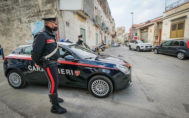 Carabinieri on the place where a man was killed for a dispute over the disputed parking space in Torre Annunziata, Naples district, Italy, 20 April 2021. A 61-year-old man was killed Monday night in a row over a parking slot near Naples, local sources and media said Tuesday. Cerrato's daughter said on her Facebook page that her father had not died after an argument but after defending her, "the light of his eyes".
ANSA/CESARE ABBATE