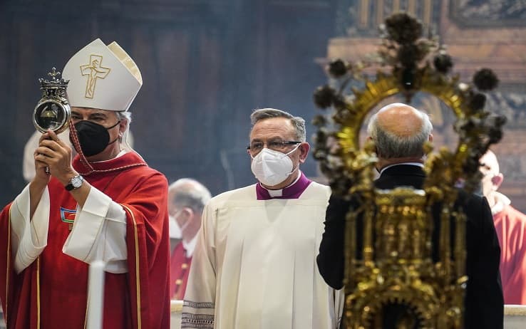 The archbishop of Naples Domenico Battaglia holds a vial said to contain the blood of the 3rd century saint San Gennaro during the so-called liquefaction in the Chapel? of the Treasury, in Naples, Italy, 19 September 2021. ANSA/CESARE ABBATE