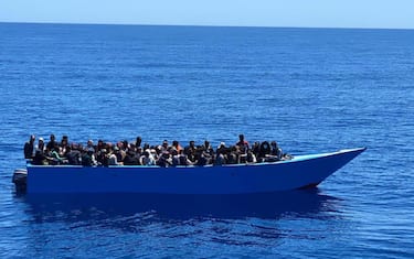 One of the two boats with a total of 415 migrants on board, in Lampedusa, Italy, 09 May 2021. The first wooden boat of 20 meters length, with 325 people on board, was intercepted eight miles off Lampedusa and the second one five miles off the coast and escorted by a security forces patrol boat to Favaloro Pier. On board were 90 migrants of different nationalities, 83 men, 6 women and a newborn baby. ANSA