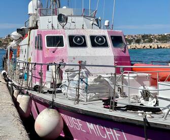 The rescue ship Louise Michel from the namesake NGO, financed by street-artist Banksy, is moored at the port of Lampedusa, Sicily, 26 March 2023. Activists aboard the ship, currently carrying around 180 migrants rescued at sea, denounced on 26 March that they were being prevented to go back at sea but that no official explanation had yet been given by Italian authorities. EPA/ELIO DESIDERIO