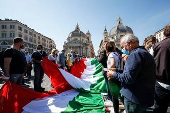A big Italian flag (the Tricolore) on the occasion of the event organized by the center-right on the occasion of the Italy's Republic Day in the centre of Rome, Italy, 02 June 2020.
ANSA/GIUSEPPE LAMI