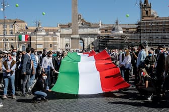 A big Italian flag (the Tricolore) on the occasion of the event organized by the center-right on the occasion of the Italy's Republic Day in the centre of Rome, Italy, 02 June 2020.
ANSA/FABIO FRUSTACI