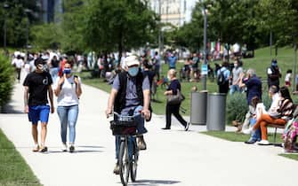 People walk, ride bycicle and relax while enjoying a sunny day inside the 'Parco di CityLife' park during the so-called phase 2 of the coronavirus emergency, in Milan, northern Italy, 24 May 2020. Italy, like several other countries around the world, is gradually easing COVID-19 lockdown restrictions in an effort to restart its economy and help people in their daily routines after the outbreak of coronavirus pandemic.
ANSA/ MATTEO BAZZI