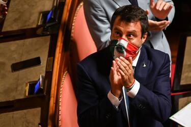 Italian senator and Lega party far-right leader Matteo Salvini, acknowledges the applause by his party colleagues, after his speech  on July 30, 2020 at Italy's Senate in Rome before the votes on whether Salvini should be stripped of his parliamentary immunity so he can be tried for the second time for allegedly illegally detaining migrants at sea. - Prosecutors in the Sicilian city of Palermo accuse Salvini of abusing his powers as then-interior minister in August 2019 to illegally prevent more than 80 migrants rescued in the Mediterranean from disembarking from the Open Arms charity ship. (Photo by Andreas SOLARO / AFP) (Photo by ANDREAS SOLARO/AFP via Getty Images)