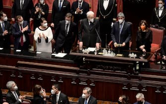 Italian re-elected 13th president Sergio Mattarella is applauded by senators and MPs after swearing in, next to President of the Italian Chamber of Deputies, Roberto Fico (2nd) and President of the Italian Senate, Maria Elisabetta Alberti Casellati (R) at the parliament in Rome's Montecitorio palace on January 3, 2022. - After Italy's bickering political parties failed to agree on a candidate for his successor, and the threat of snap elections reared its head, Mattarella finally agreed for a second term on January 29. (Photo by Filippo MONTEFORTE / AFP) (Photo by FILIPPO MONTEFORTE/AFP via Getty Images)