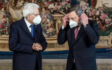 ROME, ITALY - FEBRUARY 13: Italian President Sergio Mattarella(C) and Italian Prime Minister Mario Draghi pose for a picture after the swearing-in ceremony at the Quirinal palace, on February 13, 2021 in Rome, Italy. Former President of the European Central Bank Mario Draghi was sworn in as Italyâ  s Prime Minister today, after the collapse of the Italian government last month. (Photo by Roberto Monaldo/AM POOL/Getty Images)