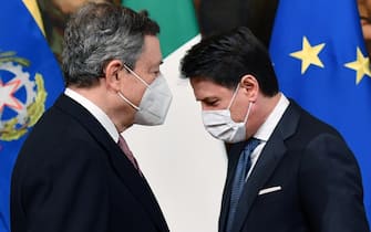 Italy's new Prime Minister Mario Draghi (L) and outgoing prime minister Giuseppe Conte, during the handover ceremony at Chigi Palace in Rome, Italy, 13 February 2021. Former European Central Bank (ECB) chief Mario Draghi has been sworn in on the day as Italy's prime minister after he put together a government securing broad support across political parties following the previous coalition's collapse. ANSA/ ETTORE FERRARI/pool