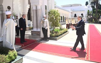 A handout photo made available by Chigi Palace press office shows Algerian President Abdelmadjid Tebboune (L) meets with Italian Prime Minister Mario Draghi (R) at the palace of El Mouradia in Algiers, Algeria, 18 July 2022. Draghi is in Algiers to attend the Italo-Algerian intergovernmental summit.   ANSA / Filippo Attili - Chigi Palace press office  +++ ANSA PROVIDES ACCESS TO THIS HANDOUT PHOTO TO BE USED SOLELY TO ILLUSTRATE NEWS REPORTING OR COMMENTARY ON THE FACTS OR EVENTS DEPICTED IN THIS IMAGE; NO ARCHIVING; NO LICENSING +++