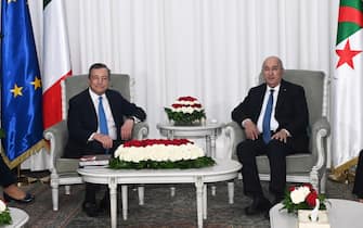 A handout photo made available by Chigi Palace press office shows Algerian President Abdelmadjid Tebboune (R) meets with Italian Prime Minister Mario Draghi (L) at the palace of El Mouradia in Algiers, Algeria, 18 July 2022. Draghi is in Algiers to attend the Italo-Algerian intergovernmental summit.   ANSA / Filippo Attili - Chigi Palace press office  +++ ANSA PROVIDES ACCESS TO THIS HANDOUT PHOTO TO BE USED SOLELY TO ILLUSTRATE NEWS REPORTING OR COMMENTARY ON THE FACTS OR EVENTS DEPICTED IN THIS IMAGE; NO ARCHIVING; NO LICENSING +++