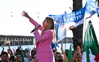 Leader of Italian far-right party "Fratelli d'Italia" (Brothers of Italy), Giorgia Meloni delivers a speech on September 23, 2022 at the Arenile di Bagnoli beachfront location in Naples, southern Italy, during a rally closing her party's campaign for the September 25 general election. (Photo by Andreas SOLARO / AFP) (Photo by ANDREAS SOLARO/AFP via Getty Images)