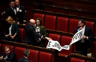 Deputies of Democratic Party protest with a banner during the election of the Speaker of the Italian Chamber of Deputies during the XIX legislature in Rome, Italy, 14 October 2022. ANSA/RICCARDO ANTIMIANI
