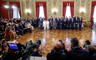 Italy's President Sergio Mattarella (4th-R) and new Prime Minister Giorgia Meloni (5th-R) pose with members of the new cabinet during the swearing-in ceremony of the new Italian Government at the Quirinal Palace in Rome on October 22, 2022. - Italy OUT (Photo by FABIO FRUSTACI / ANSA / AFP) / Italy OUT (Photo by FABIO FRUSTACI/ANSA/AFP via Getty Images)