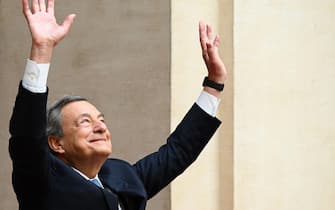 Italy's outgoing Prime Minister, Mario Draghi waves as he leaves after a handover ceremony at Palazzo Chigi in Rome on October 23, 2022. - Far-right leader Giorgia Meloni was named Italian prime minister on October 21, 2022 after her party's historic election win, becoming the first woman to head a government in Italy. (Photo by Vincenzo PINTO / AFP) (Photo by VINCENZO PINTO/AFP via Getty Images)