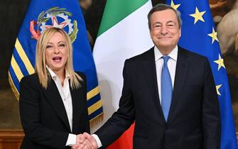 Italy's new Prime Minister Giorgia Meloni (L) and outgoing Prime Minister Mario Draghi during the handover ceremony at Chigi Palace in Rome, Italy, 23 October 2022.  ANSA/ETTORE FERRARI