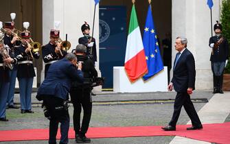 Italy's outgoing Prime Minister, Mario Draghi leaves after a handover ceremony at Palazzo Chigi in Rome on October 23, 2022. - Far-right leader Giorgia Meloni was named Italian prime minister on October 21, 2022 after her party's historic election win, becoming the first woman to head a government in Italy. (Photo by Vincenzo PINTO / AFP) (Photo by VINCENZO PINTO/AFP via Getty Images)