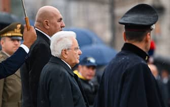 Italy's President Sergio Mattarella (C) and Italy's Defence Minister Guido Crosetto arrive at the Altare della Patria monument to lay a wreath at the tomb of the unknown soldier in Rome on November 4, 2022 as part of celebrations of National Unity and Armed Forces Day, marking the end of the World War I in Italy. (Photo by Andreas SOLARO / AFP) (Photo by ANDREAS SOLARO/AFP via Getty Images)