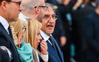 Italy's new Prime Minister, Giorgia Meloni (C), President of the Italian Senate, Ignazio La Russa (R) and other officials arrive at the Altare della Patria monument to lay a wreath at the tomb of the unknown soldier in Rome on November 4, 2022 as part of celebrations of National Unity and Armed Forces Day, marking the end of the World War I in Italy. (Photo by Andreas SOLARO / AFP) (Photo by ANDREAS SOLARO/AFP via Getty Images)