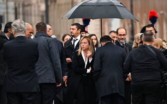 Italy's new Prime Minister, Giorgia Meloni (C) and President of the Italian Senate, Ignazio La Russa (C-R) and other officials arrive at the Altare della Patria monument to lay a wreath at the tomb of the unknown soldier in Rome on November 4, 2022 as part of celebrations of National Unity and Armed Forces Day, marking the end of the World War I in Italy. (Photo by Andreas SOLARO / AFP) (Photo by ANDREAS SOLARO/AFP via Getty Images)