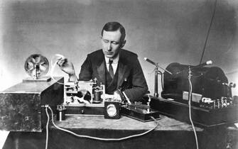 UNSPECIFIED - CIRCA 1754: Guglielmo Marconi (1874-1937), Italian physicist and inventor. Radio pioneer. Marconi with typical apparatus, including 10-inch induction coil spark transmitter (right), morse inker and 'grasshopper' key in centre. Photograph. (Photo by Universal History Archive/Getty Images)