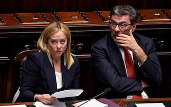 Italian Prime Minister, Giorgia Meloni (L), with Italian Minister of Economy, Giancarlo Giorgetti (R), ahead of a confidence vote for the new government, at the Chamber of Deputies, the lower house of parliament, in Rome, Italy, 25 October 2022. ANSA/RICCARDO ANTIMIANI