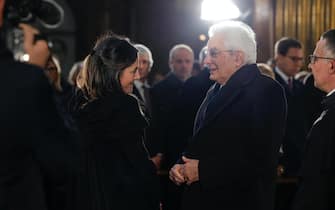 Stella Coppi e il presidente della Repubblica Sergio Mattarella nella chiesa di Santi Apostoli durante il funerale di Franco Frattini, Roma, 27 Dicembre 2022. ANSA/GIUSEPPE LAMI