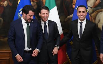 Italian Prime Minister Giuseppe Conte (C) with his vice Prime Ministers Luigi Di Maio (R) and Matteo Salvini (L) after receiving from the outgoing Prime Minister Paolo Gentiloni the small silver bell to open the First Council of Minister at Chigi Palace in Rome, 1 Jun 2018. ANSA/CLAUDIO PERI