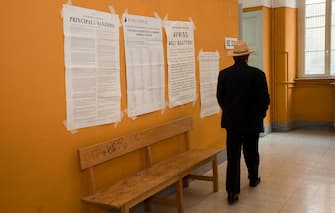ROME, ITALY - JUNE 13:   A man enters a polling station to vote for the Italian referendum on nuclear power, on June 13, 2011 in Rome, Italy. The country has been committed to a referendum on June 12-13, 2011 on the re-introduction of nuclear power, on the privatization of water and on 'legittimo impedimento', a law that would grant immunity to Prime Minister Silvio Berlusconi from many ongoing trials accusing him of various crimes.  (Photo by Giorgio Cosulich/Getty Images)
